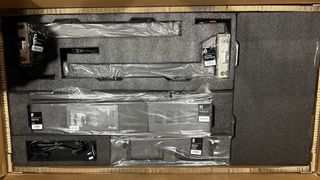 The contents inside the Secretlab Magnus Evo box with each individual part for assembly.