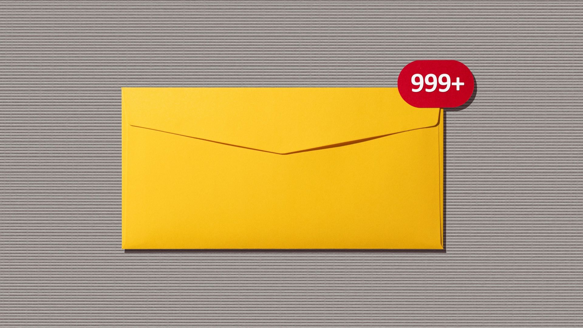 Front view of Message Notification on Yellow Envelope on Gray Paper Background