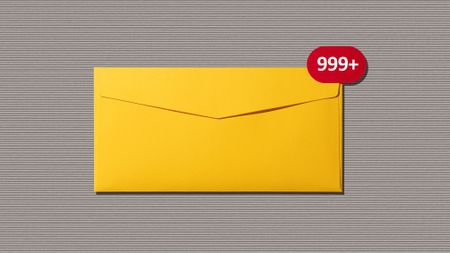 Front view of Message Notification on Yellow Envelope on Gray Paper Background