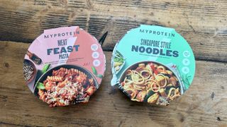 Myprotein meat feast pasta and Singapore-style noodles in packaging