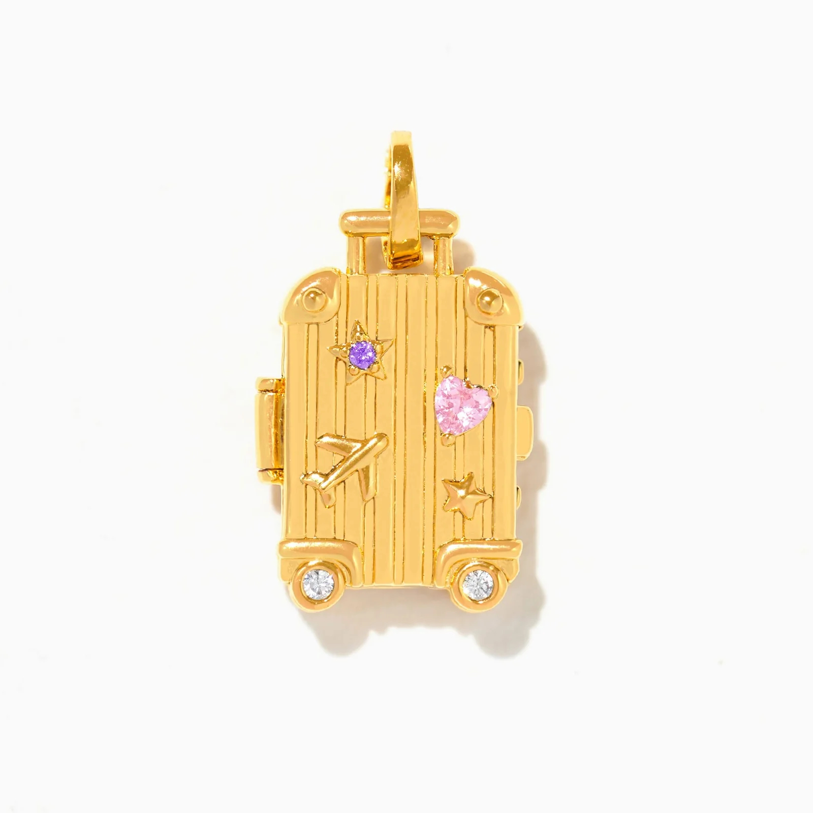 A gold plated Girls Crew Carry-On charm