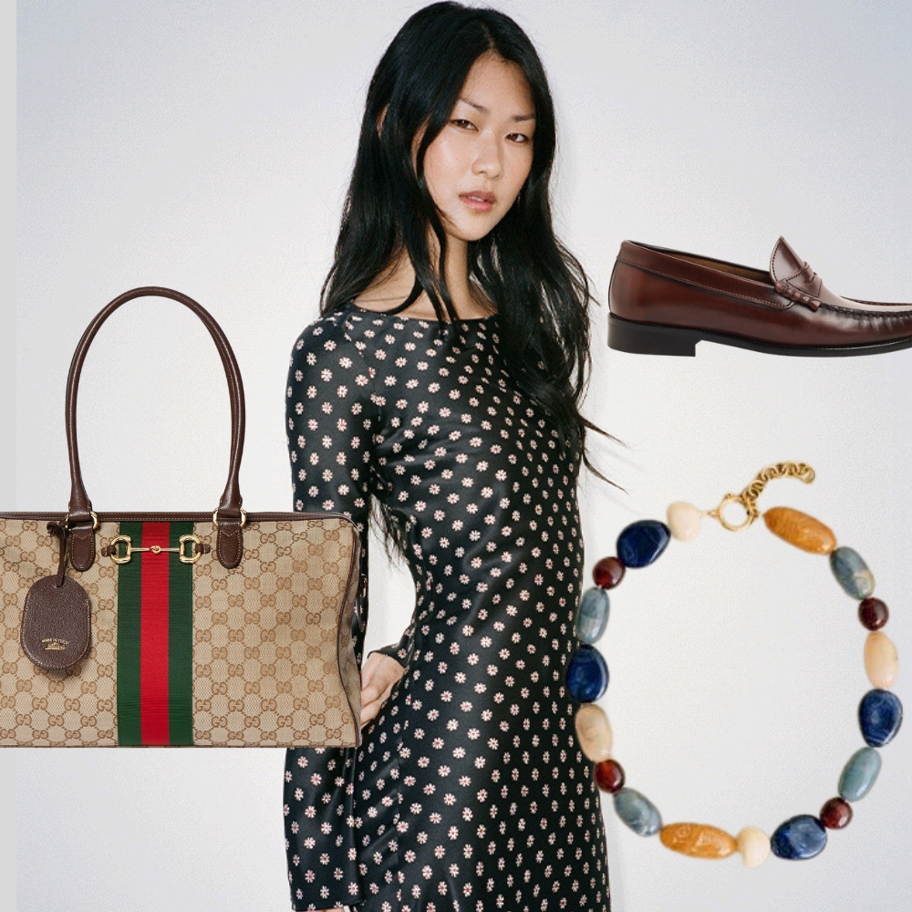 A model wearing a black floral dress from Realisation Par 