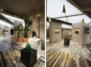 Interior design of store with golden light fittings and marble effect flooring