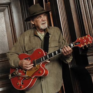 Duane Eddy holding his Gretsch guitar