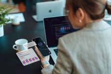 Woman using AI on smartphone for financial advice