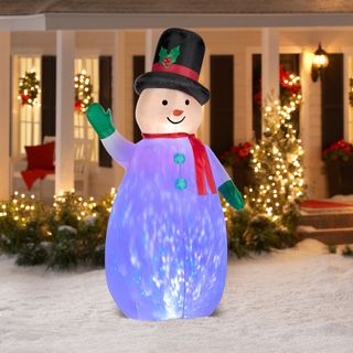 Pre-lit snowman figure in Christmas front yard