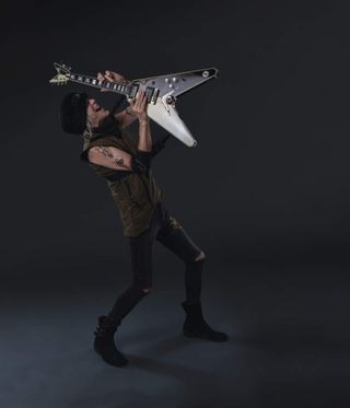 Michael Schenker with his Flying V (studio portrait)