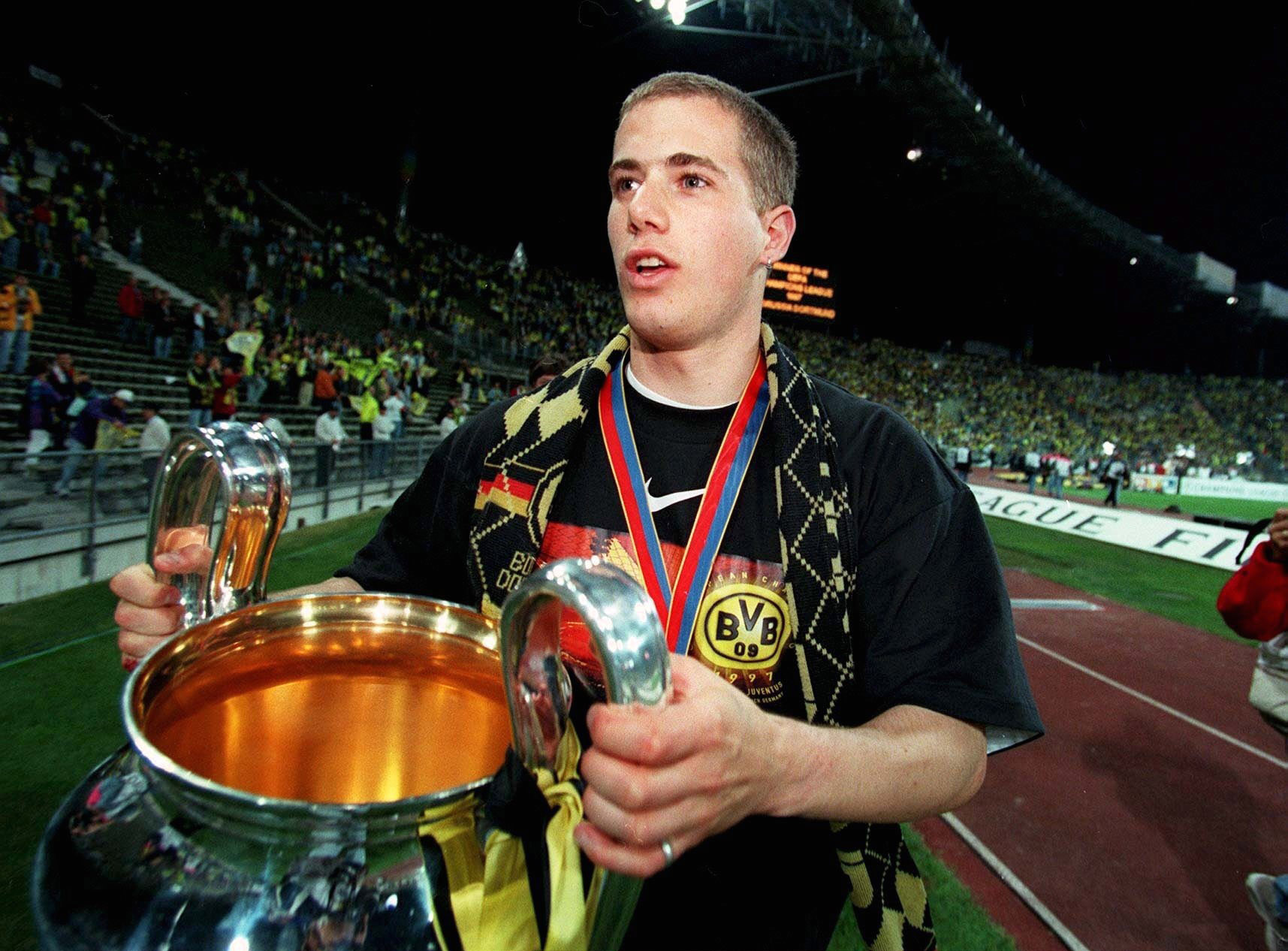 Lars Ricken celebrates with the trophy after Borussia Dortmund's 3-1 win over Juventus in the 1997 Champions League final in Munich.