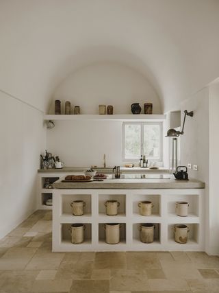 A kitchen with storage in the island