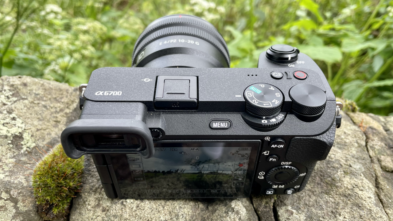 Sony Alpha A6700 mirrorless camera outside on a wall