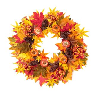 A fall wreath with red, orange, yellow, and green leaves and brown pinecones and orange pumpkins