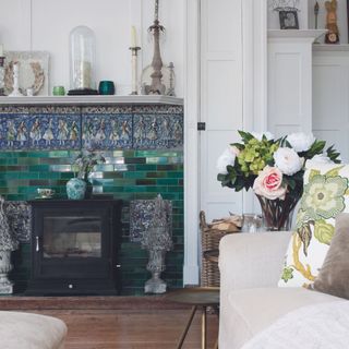 statement arts and crafts tiled fireplace in white living room