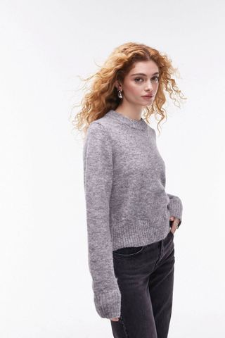 grey jumpers - woman wearing grey jumper with black jeans