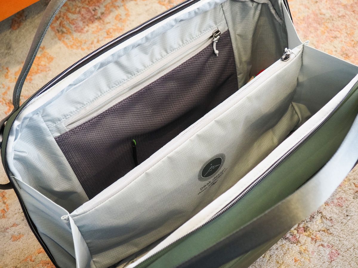 The Peak Design Travel Weekender 25L bag open and the main compartment visible