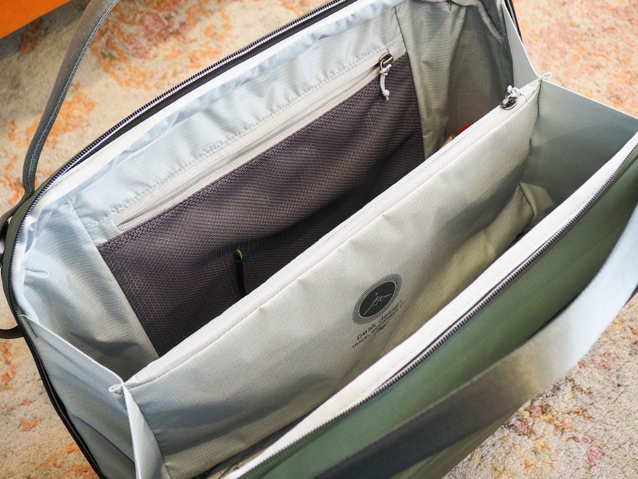 The Peak Design Travel Weekender 25L bag open and the main compartment visible