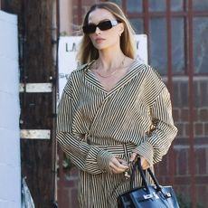 Margot Robbie debuted her first Herm&egrave;s Birkin bag with a pinstripe matching set