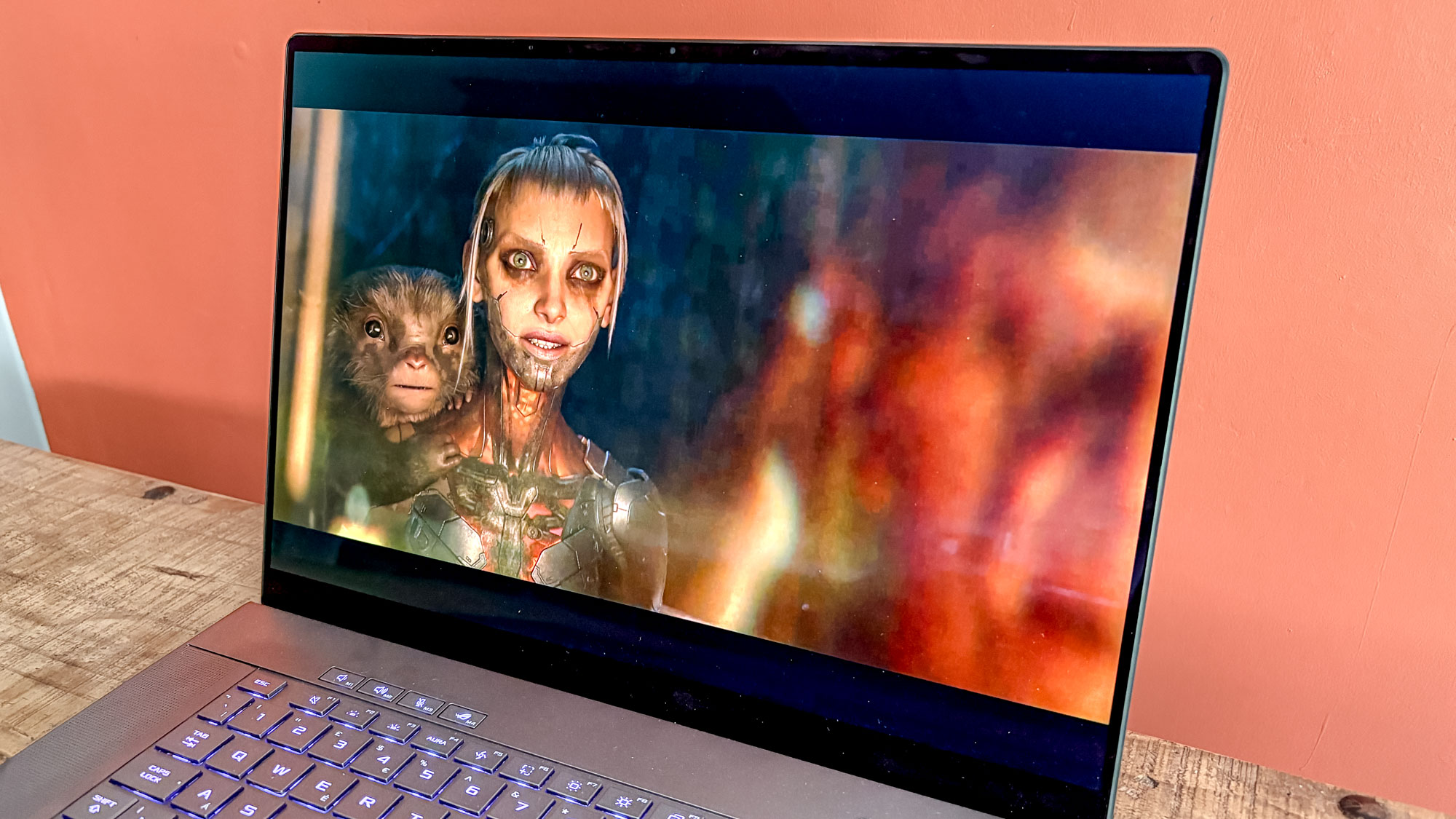 Asus ROG Zephyrus G16 on table with Spider Rose episode of Love Death and Robots on display