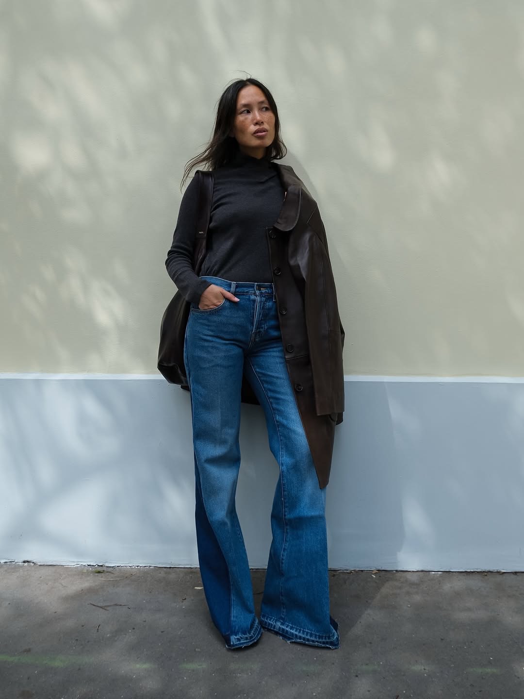 woman wearing leather trench coat jean outfit spring 2026