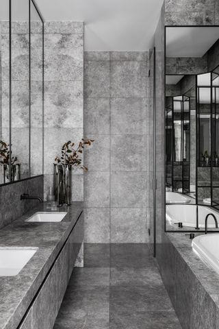 Grey stone clad bathroom at Armadale Residence in Australia