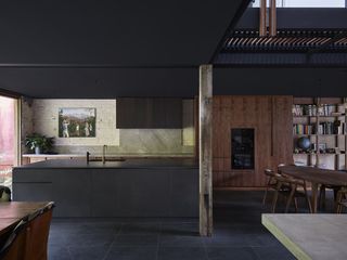 Open plan kitchen area at Stockroom Cottage by Architects EAT