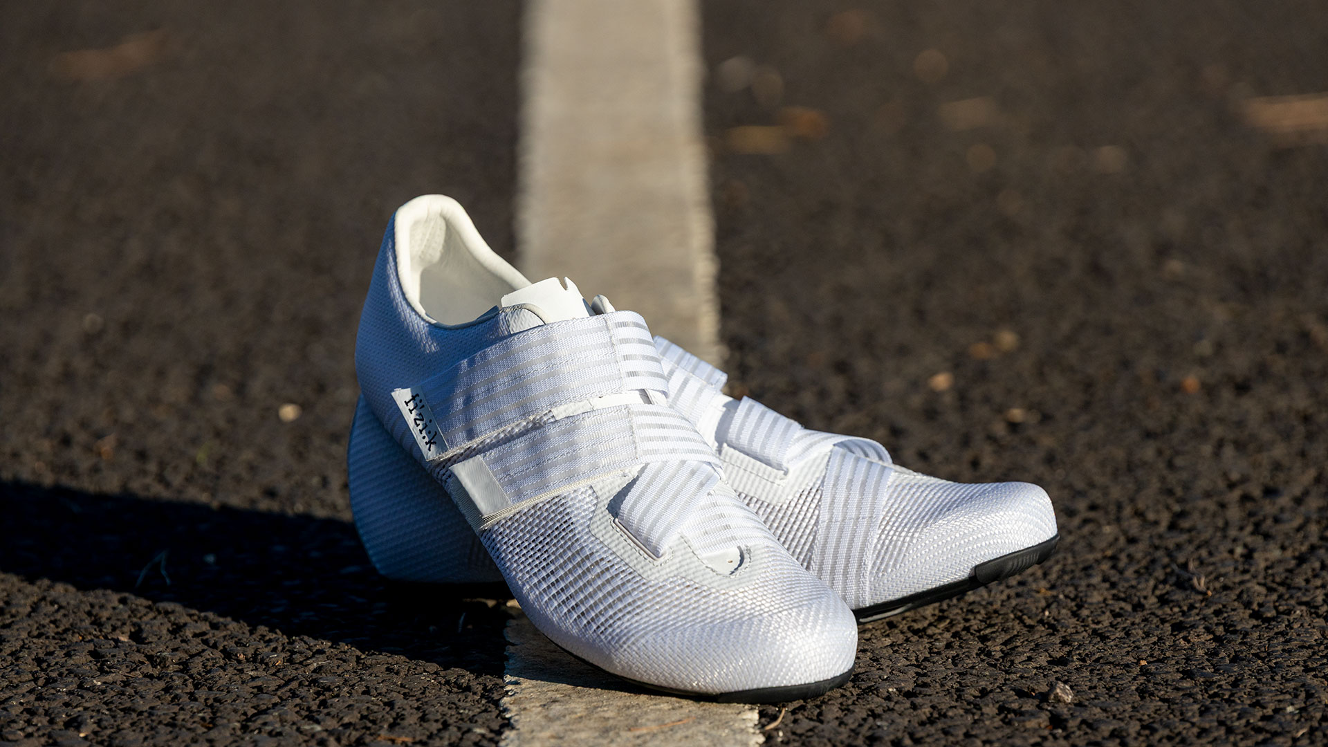 Fizik Powerstrap Aeroweave shoes on a tarmac road