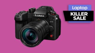 Black Panasonic Lumix GH6 mirrorless camera against pink background