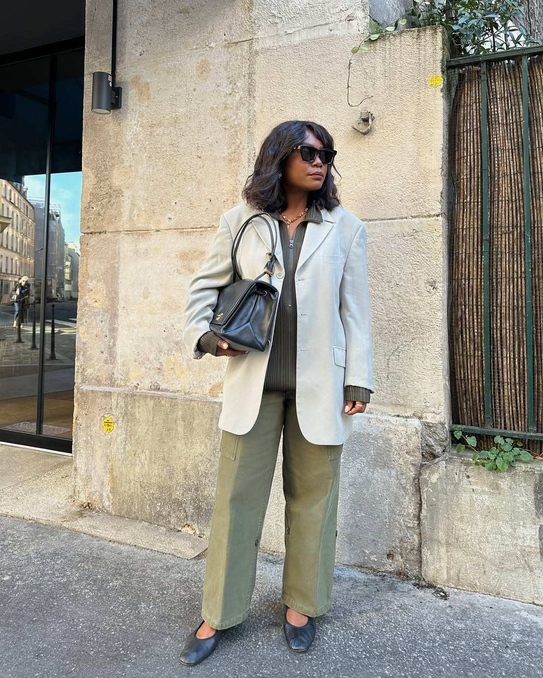 frannfyne wears khaki trousers and grey blazer