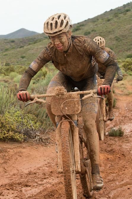 Annika Langvad and Ariane Kleinhans of team RECM2 charge through the mud