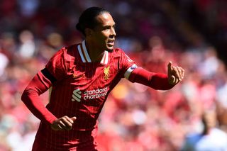 Liverpool squad for 2024/25 Liverpool's Dutch defender #04 Virgil van Dijk reacts during the pre-season friendly football match between Liverpool and Sevilla at Anfield stadium in Liverpool, northwest England on August 11, 2024. (Photo by Peter POWELL / AFP) (Photo by PETER POWELL/AFP via Getty Images)