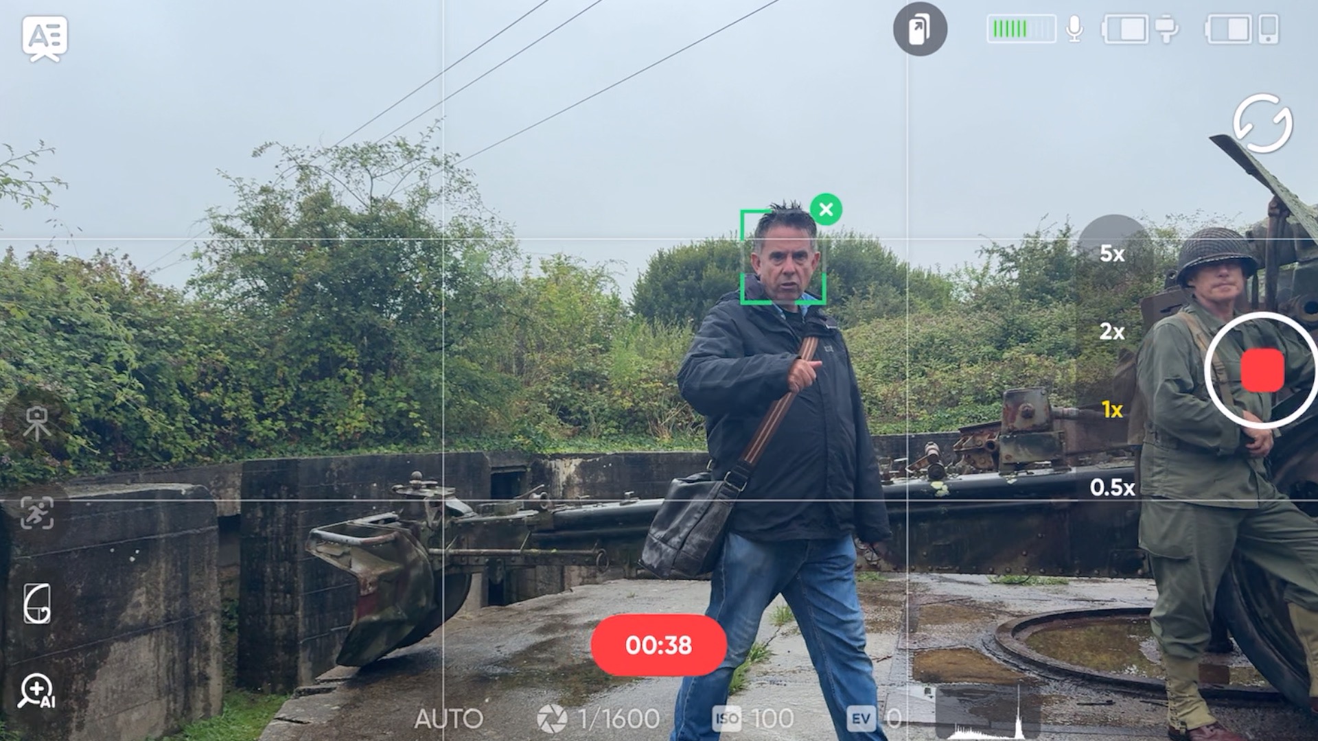 A shot of a presenter walking and talking hands free while the gimbal rests on its tripod legs