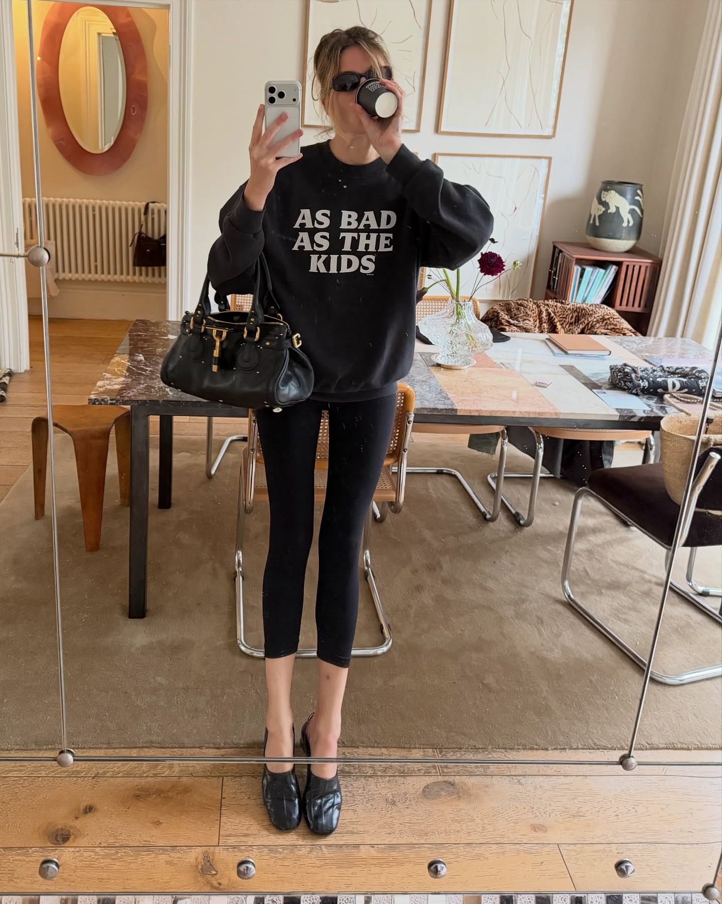 Influencer @camillecharriere wears a high vamp ballet pumps with leggings and a sweatshirt