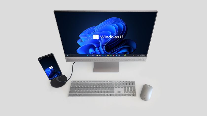The NexPhone connected to a monitor and peripherals running Windows 11