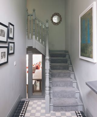 Deborah and Ultan Herr’s traditional villa with grey painted staircase and victorian style tiles