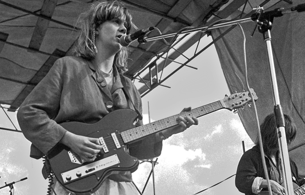 Gina Birch of The Raincoats performing at Alexandra Palace, London, UK, 16th June 1980. She is playing a Hayman 1010 electric guitar.