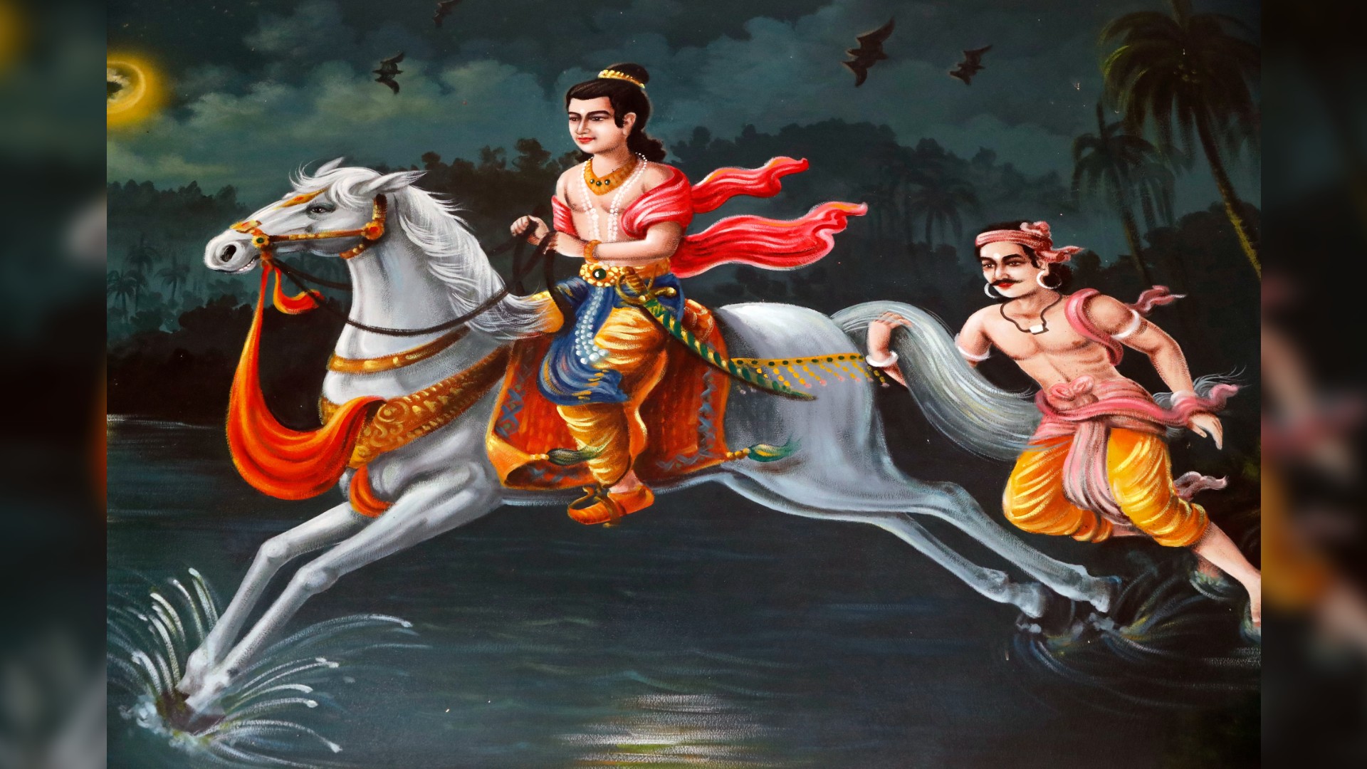 Painting of The Life of the Buddha, Siddhartha Gautama. Prince Siddhartha (long black hair up in a bun, shirtless, blue trousers, knee-high brown riding boots, and adorned with gold jewelery) is riding on Kanthaka his favorite stallion (A large white horse galloping in the water, adorned with a gold bridge and an orange rug as a saddle) and followed by Channa his loyal charioteer (hanging onto the white stallion’s tail, he has long dark hair, tied up, a pink headband, shirtless, yellow trousers and a pink sash around his waist). It is nighttime and on the far left is a glowing yellow moon, cloudy skies, and also bats in the air. Chau Doc, Vietnam.