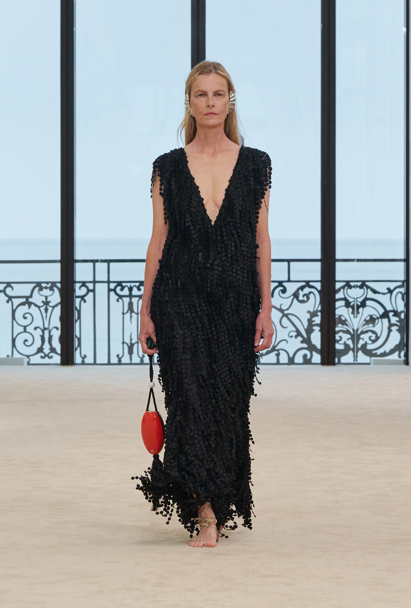 A model wore the sole-less sandals with Margaret Qualley's dress on Chanel's Cruise 2027 runway