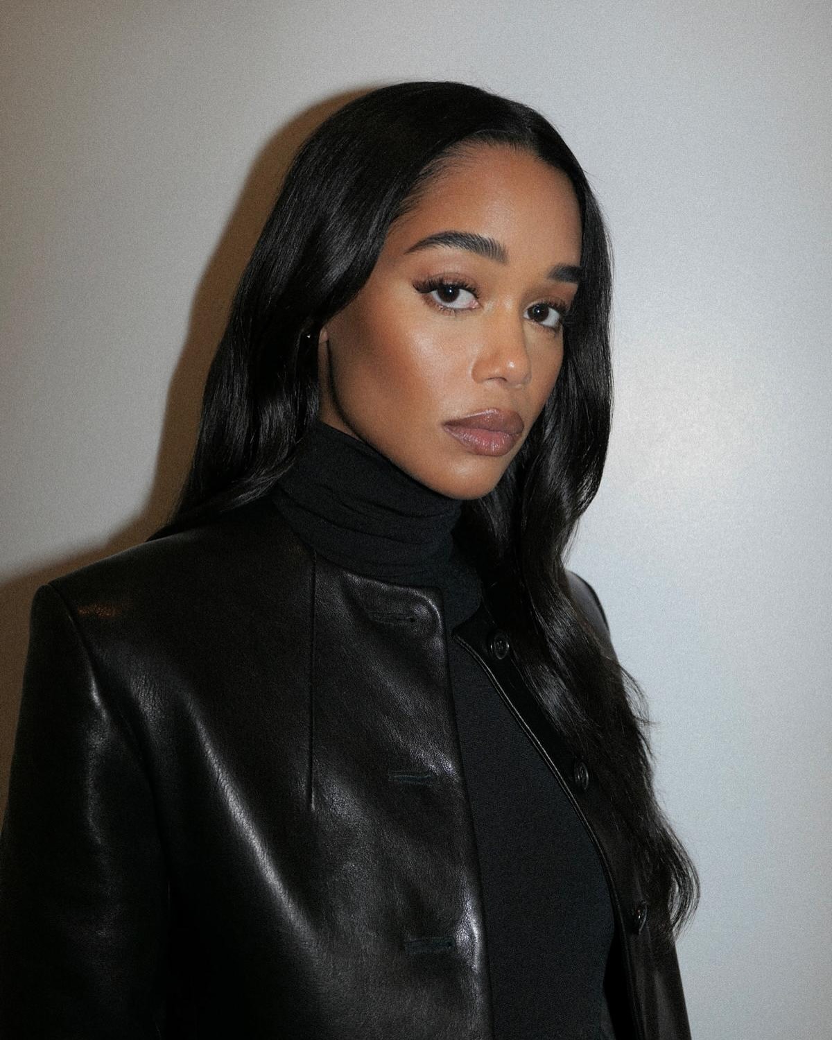 Laura Harrier wearing leather jacket