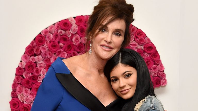Caitlyn and Kylie Jenner embrace as they pose for the camera.