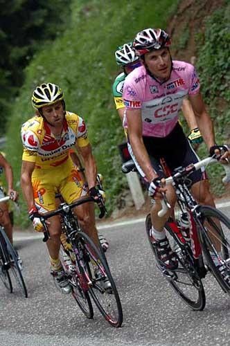 Ivan Basso (r) gets out of the saddle as he's about to blast off on another solo attack before the finish