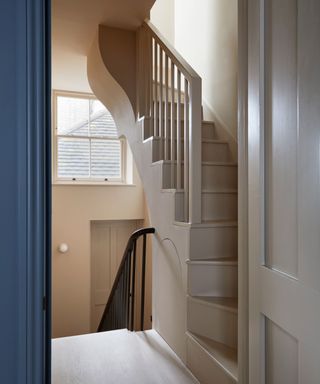 hallway and staircase color-drenched in neutral paint