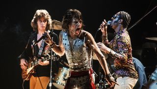 Mick Taylor (L) and Mick Jagger (C) of the Rolling Stones perform with Stevie Wonder (R) at Madison Square Garden. The concert was the final performance of the group's 30-city, 3-month tour of the United States and Canada.