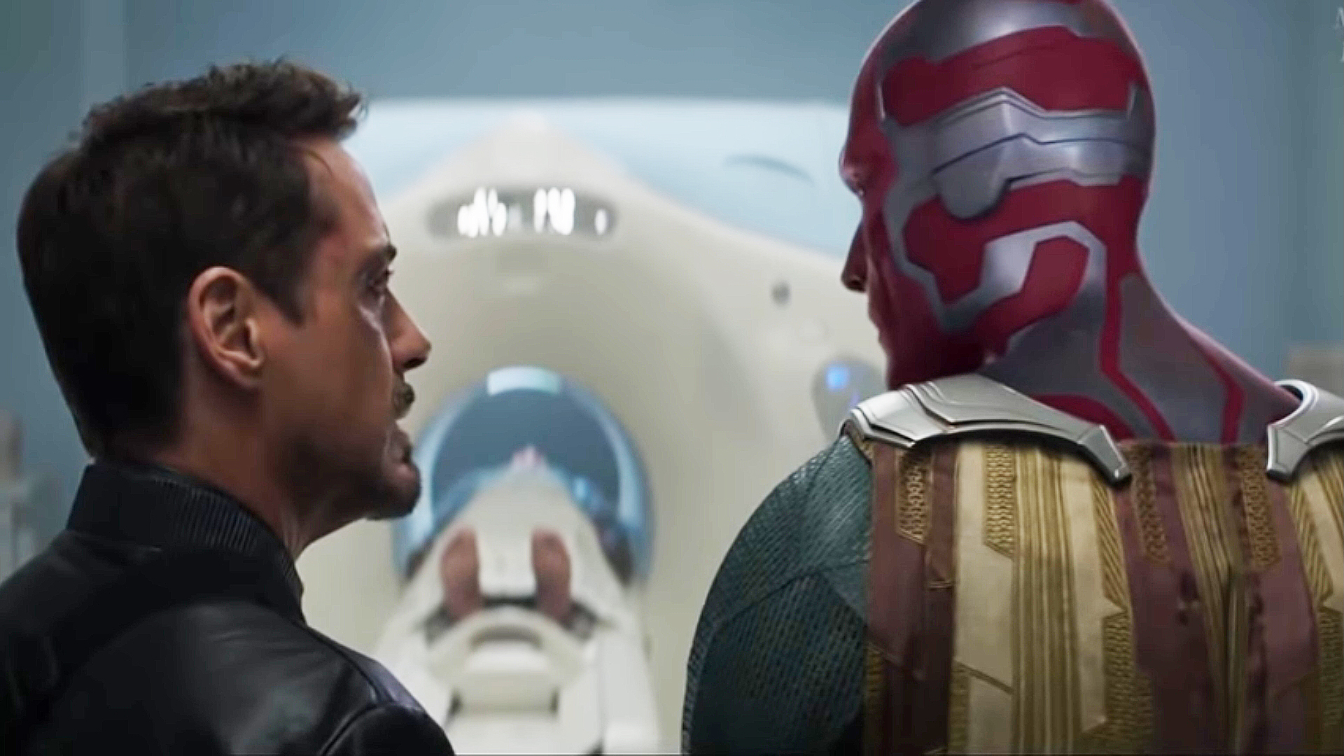 Robert Downey Jr's Tony Stark and Paul Bettany' Vision looking at each other in Captain America: Civil War
