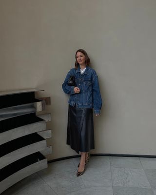 Influencer wish list 2025: @ruerodier wears a denim jacket and leather midi skirt