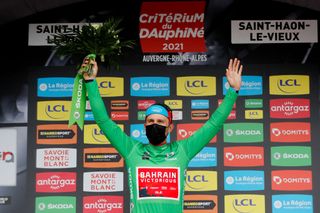 SAINT HAON LE VIEUXON FRANCE JUNE 01 Sonny Colbrelli of Italy and Team Bahrain Victorious Green Points Jersey and stage winner celebrates at podium during the 73rd Critrium du Dauphin 2021 Stage 3 a 1722km stage from Langeac to Saint Haon Le Vieuxon Trophy UCIworldtour Dauphin dauphine June 01 2021 in Saint Haon Le Vieuxon France Photo by Bas CzerwinskiGetty Images