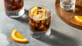 Espresso tonic in glass with orange slice