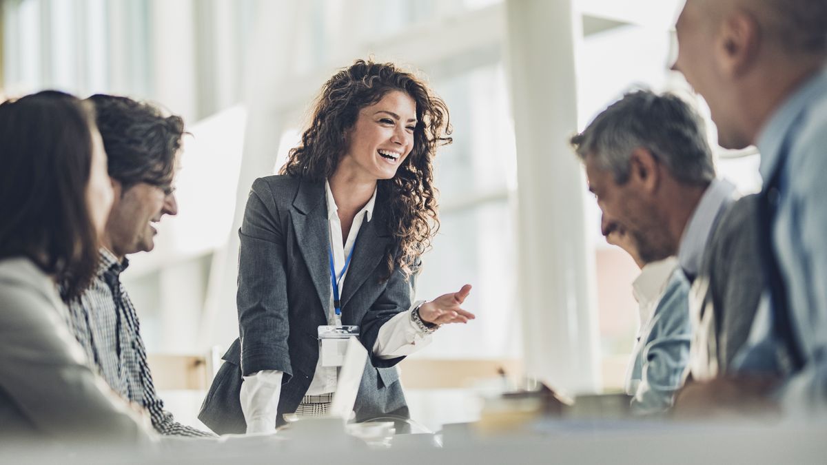 Female business leader talking to her staff in a meeting