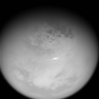 Clouds on Titan are visible in this image taken by the Cassini spacecraft in October, 2016, with the probe's narrow angle camera, capturing light in the near-infrared range, which makes Titan's thick atmosphere slightly more transparent.