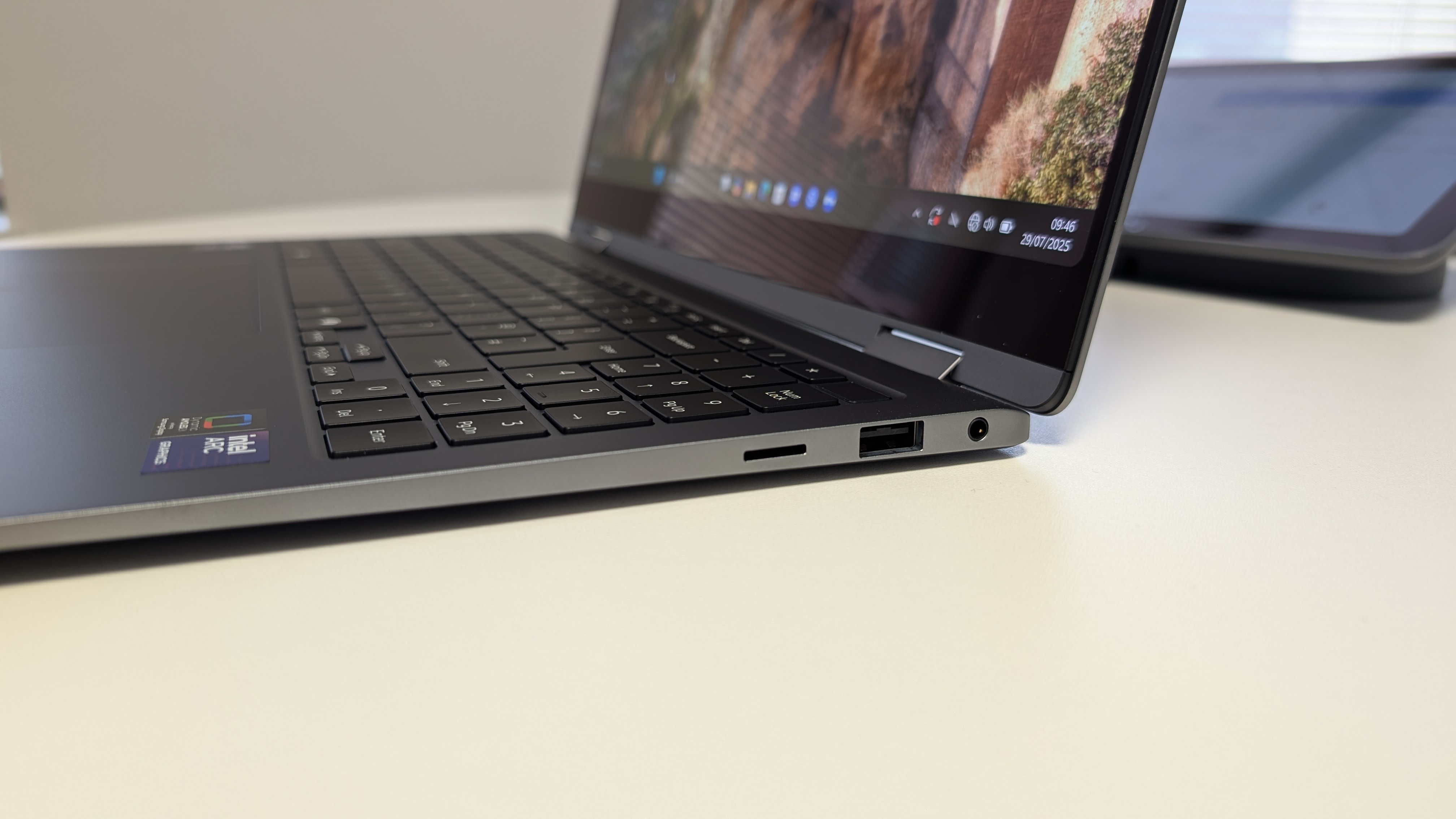 The Samsung Galaxy Book5 Pro 360 photographed on a white desk.