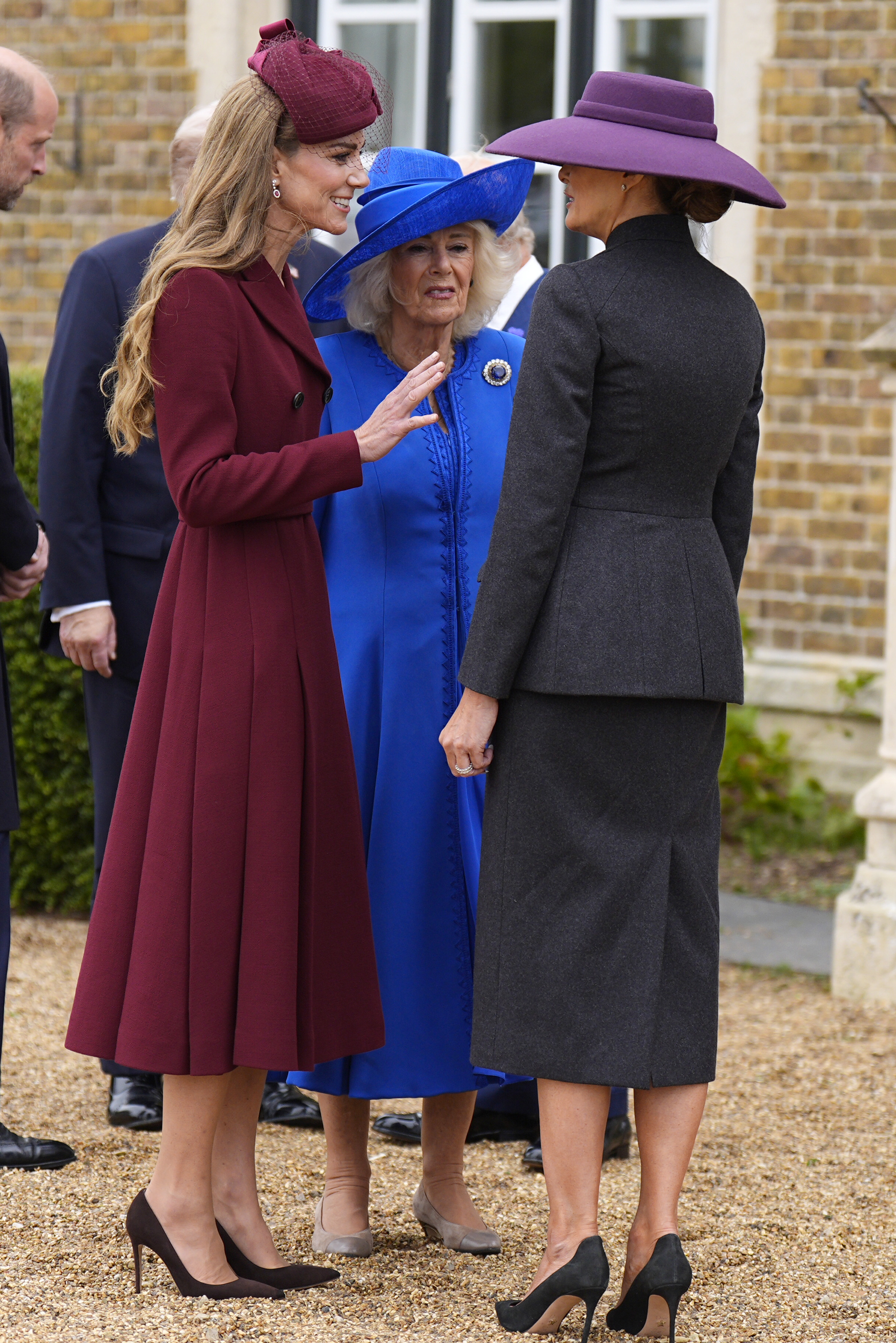 Kate MIddleton wears a wine coat dress and greets Melania Trump during the US state visit on September 17