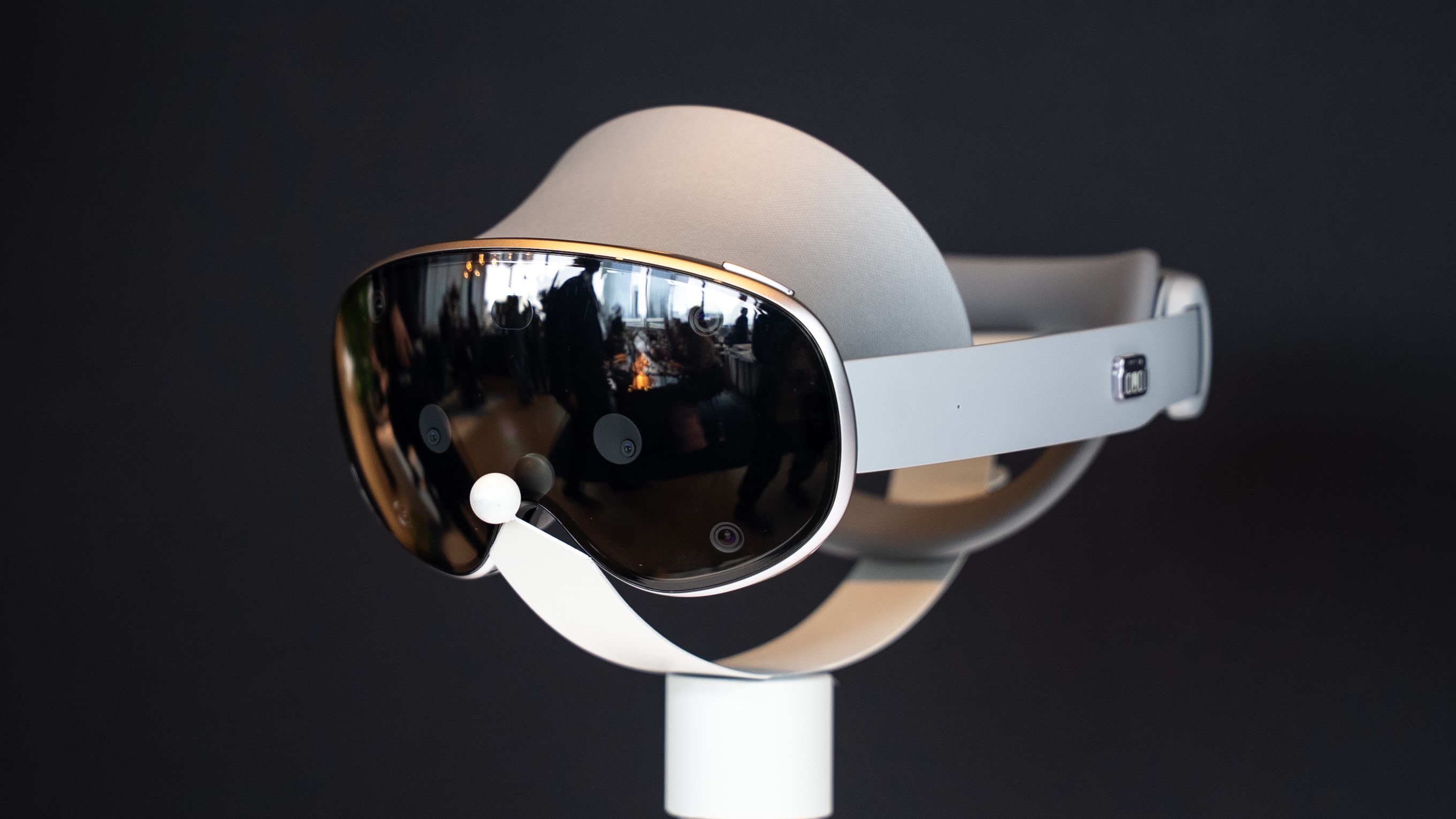 A photo of Samsung Galaxy XR sitting on a podium at a 30-degree front-left angle.